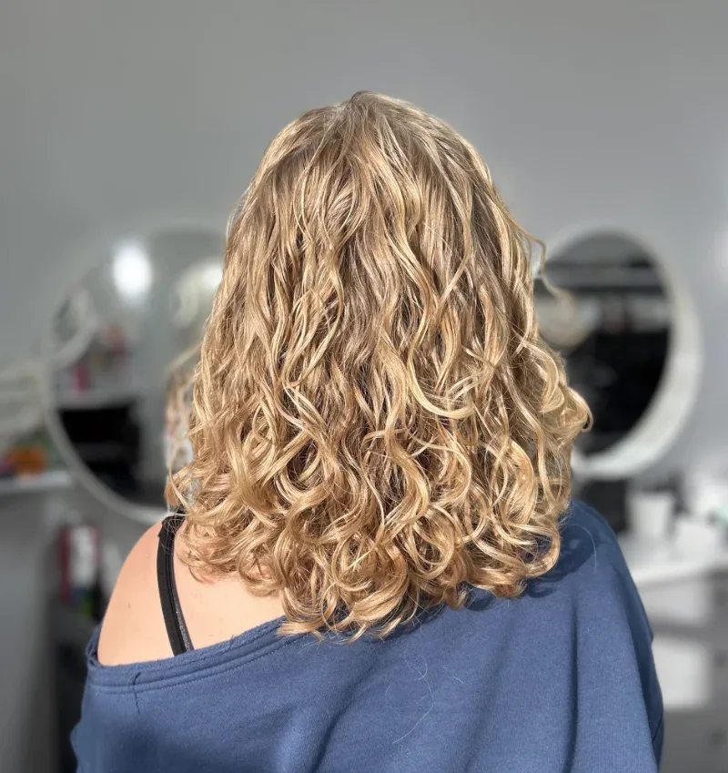 Finished Curly Haircut Showing Natural Texture and Defined Curls at Sharper Image Hair Design in Red Deer